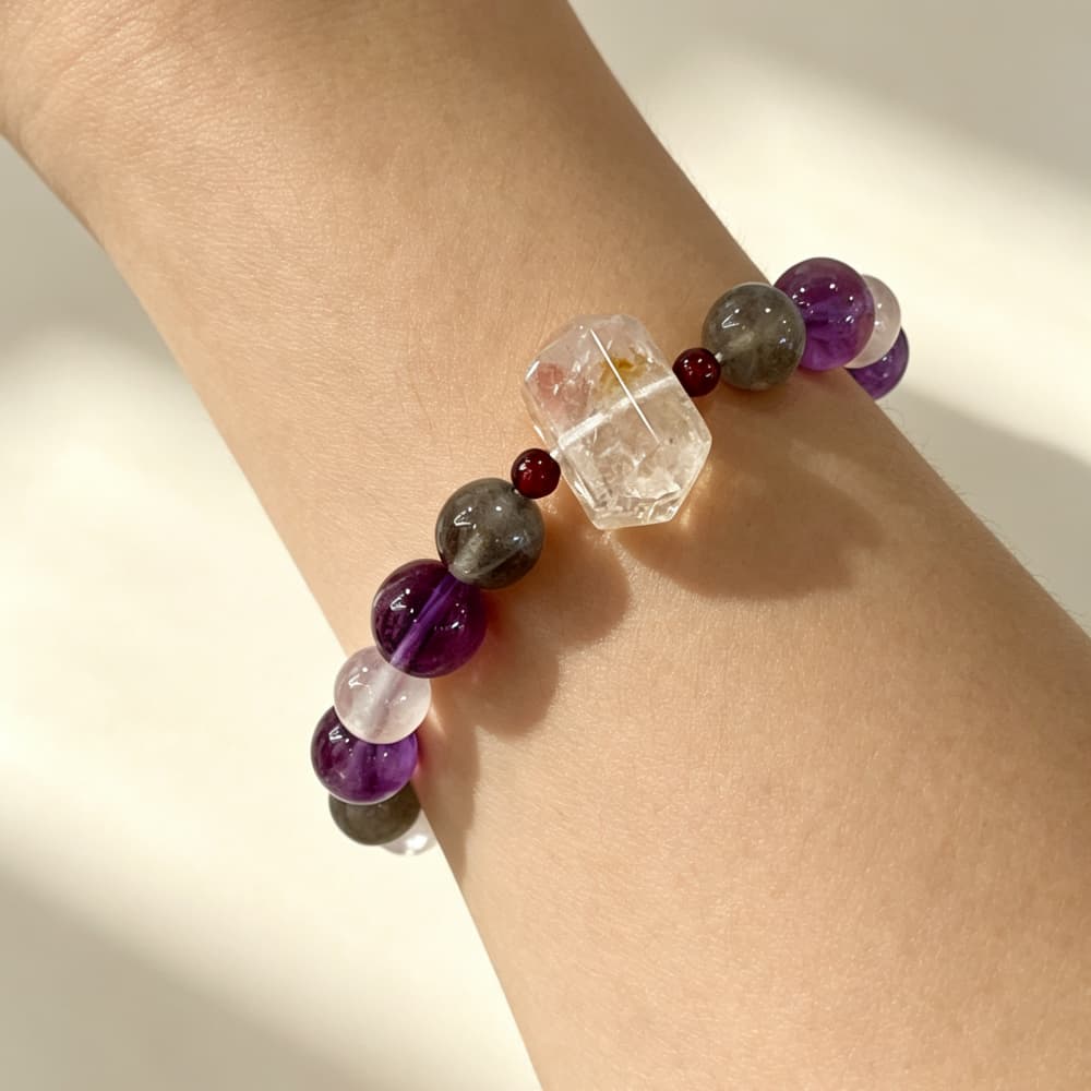 Woman wearing Moonlit Serenity natural crystal bracelet on her wrist