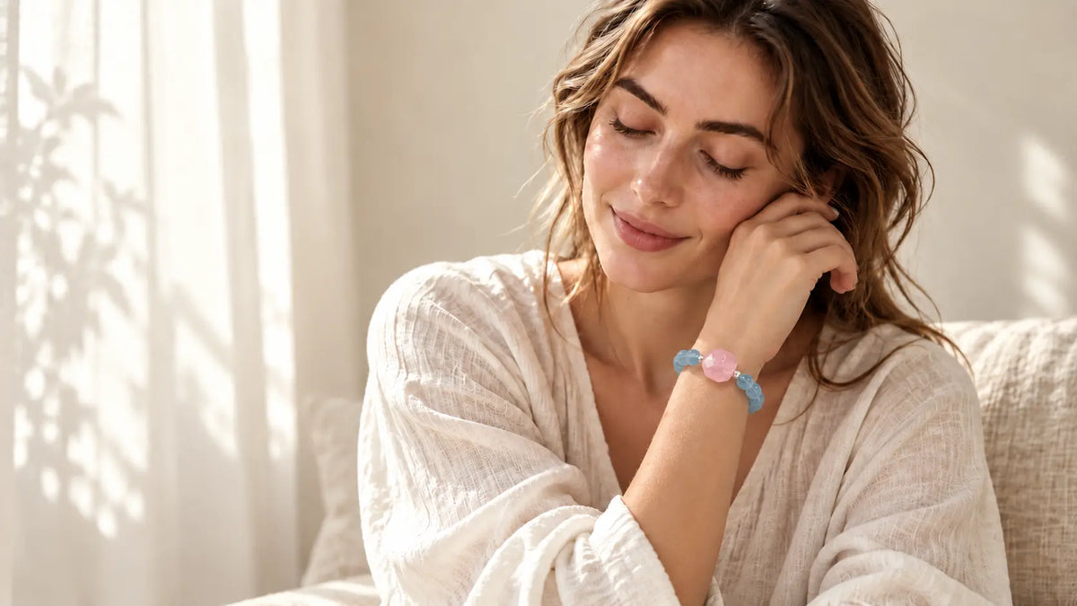 Model wearing a natural aquamarine and rose quartz bracelet in soft morning light